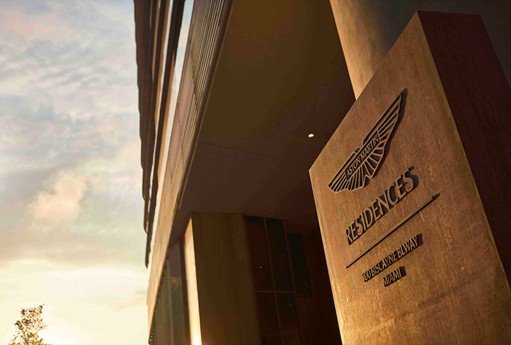 Aston Martin Residences Miami luxury development sign at sunset, showcasing new high-end real estate transforming Miami's skyline and urban landscape